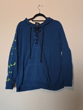 Haunted Mansion Blue Lace-Up Hoodie with Neon Green Eye Detail GITD